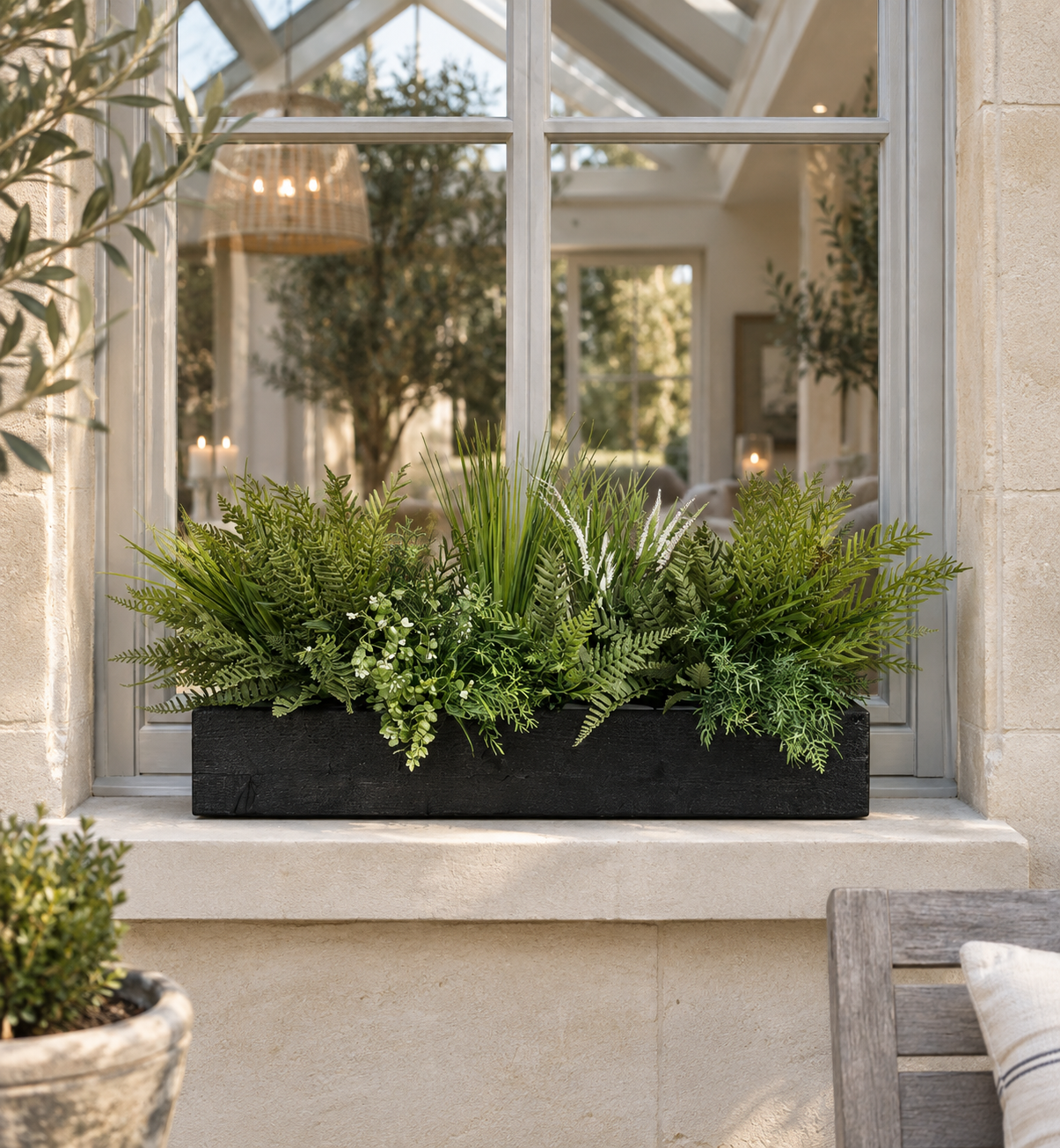 Rustic Rosemary Artificial Window Box ustic Rosemary artificial window box with ferns and foliage on an orangery window ledge