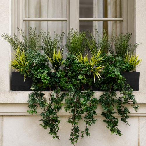 Artificial Kitchen Garden Window Box with trailing ivy and mixed green foliage on an elegant exterior windowsill