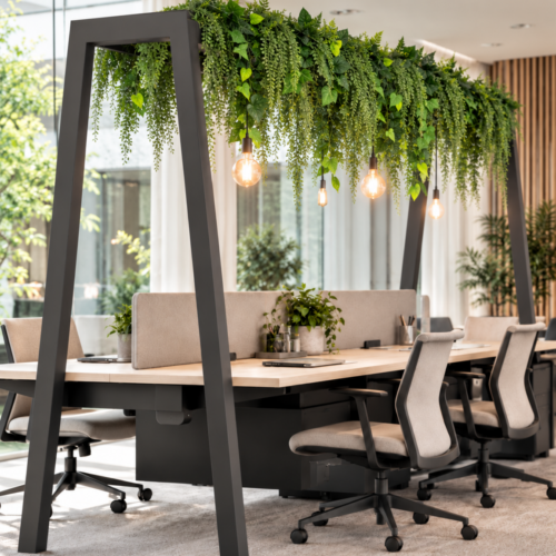 Artificial Canopy Bench Foliage Bar with trailing ferns and mixed green leaves above shared office desks